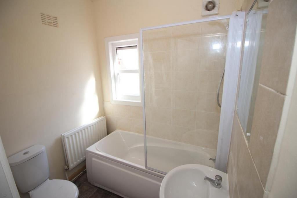 This well-maintained bathroom features a clean ...
