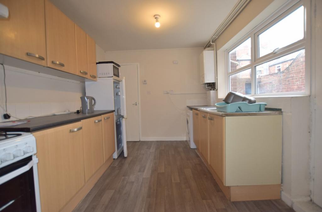 A spacious and practical kitchen with ample sto...
