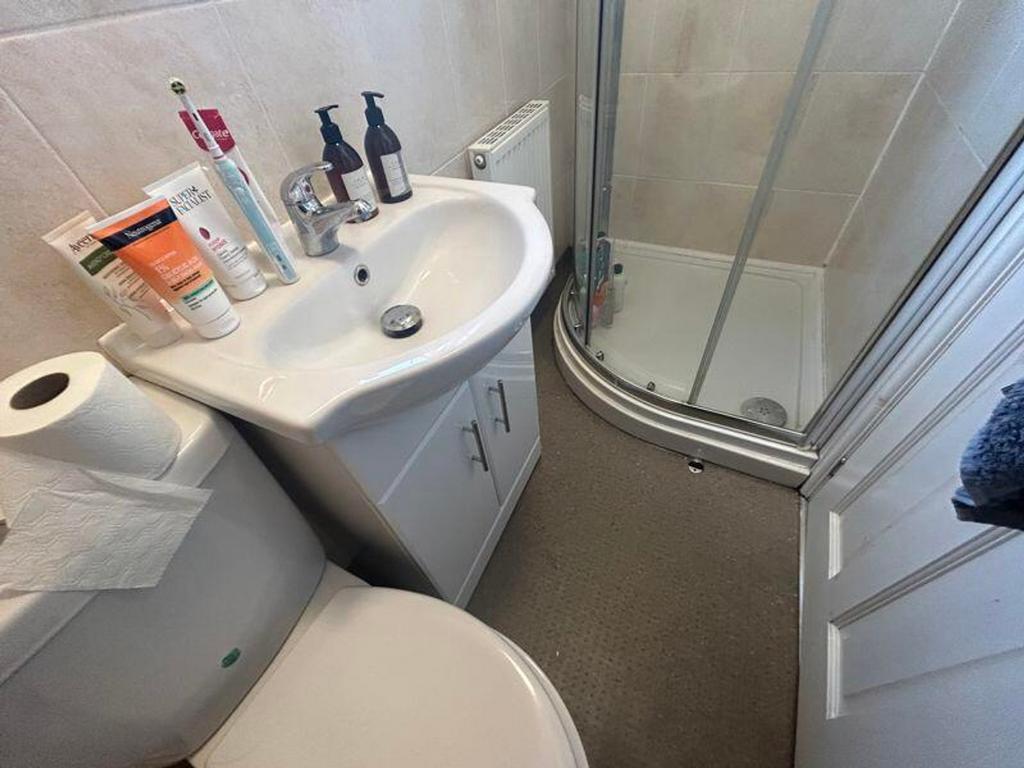 A tidy and functional bathroom featuring modern...