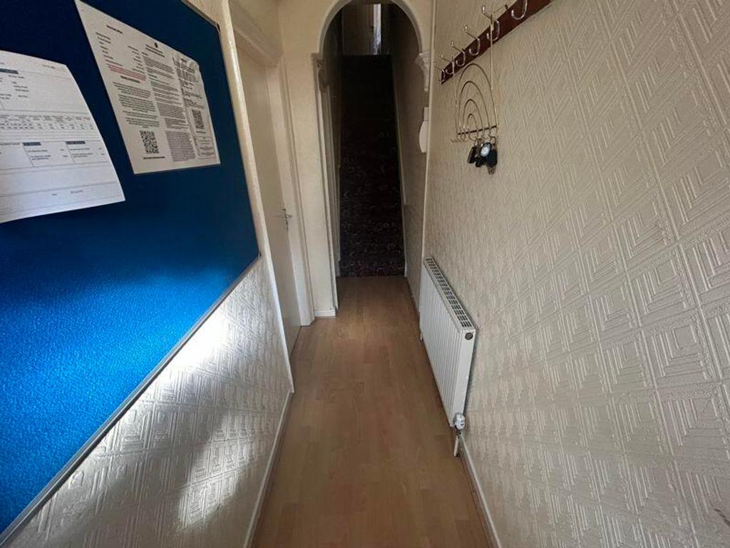 A tidy and well-maintained hallway with a warm ...