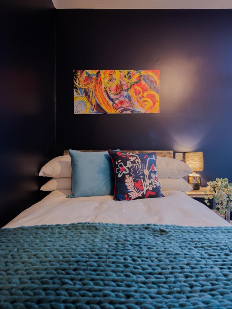 This beautifully styled double bedroom features...