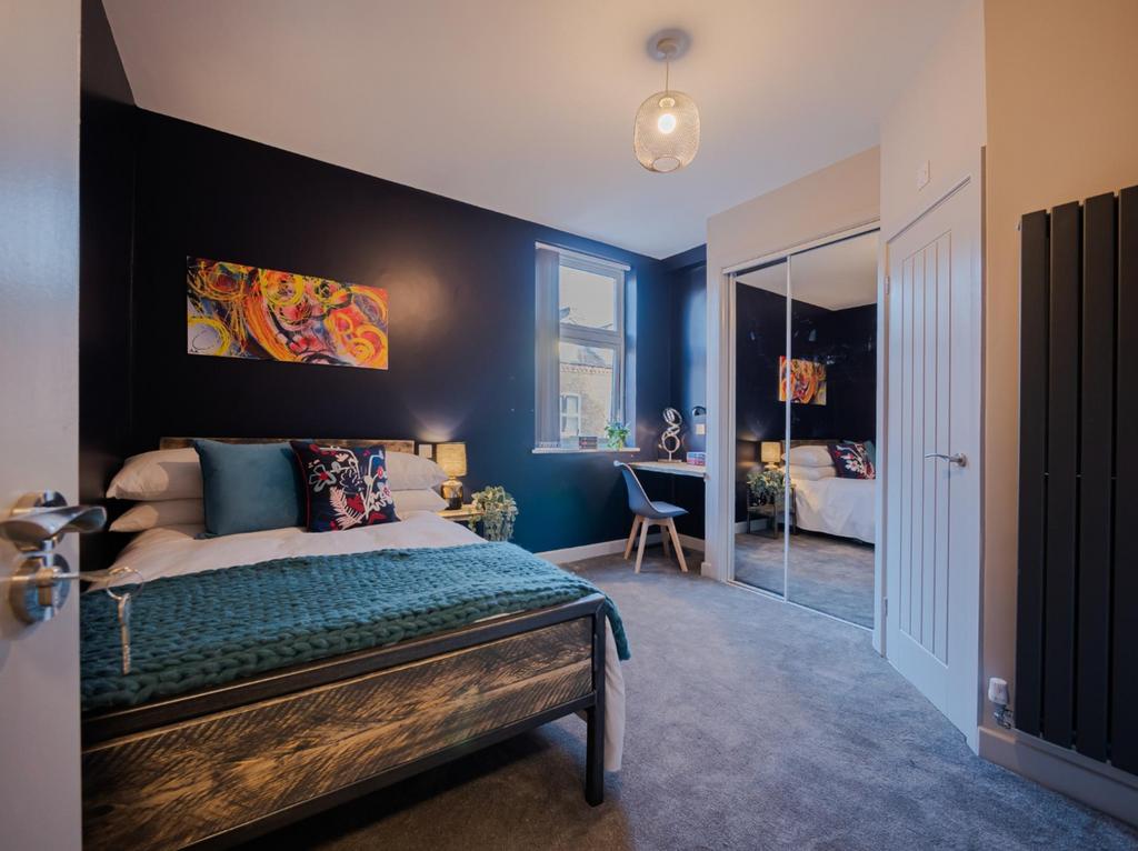 A beautifully designed double bedroom featuring...