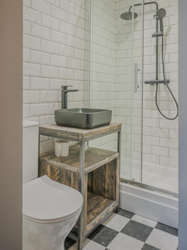 A modern and stylish bathroom featuring sleek f...