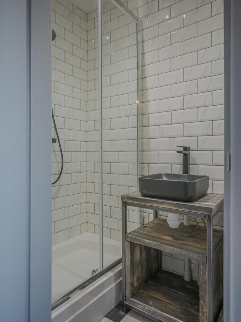 Modern bathroom featuring sleek design with a s...