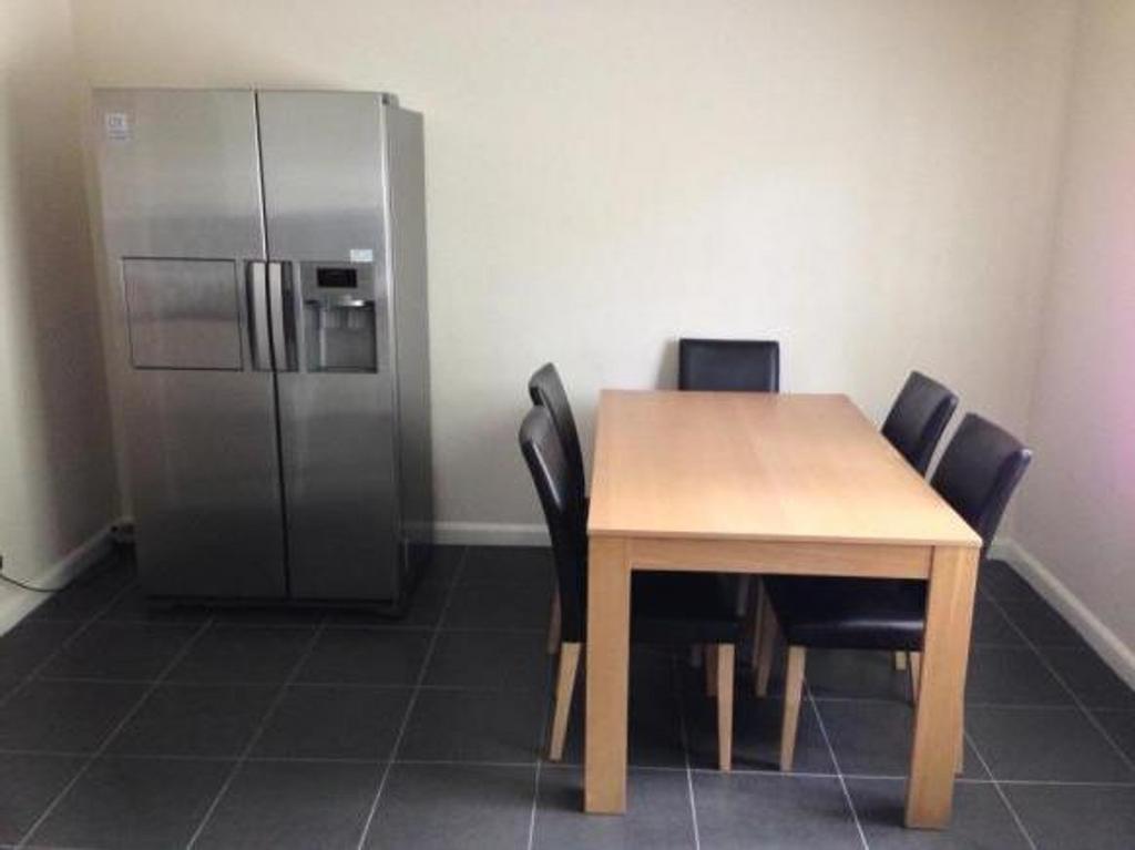 Bright and spacious kitchen area featuring mode...