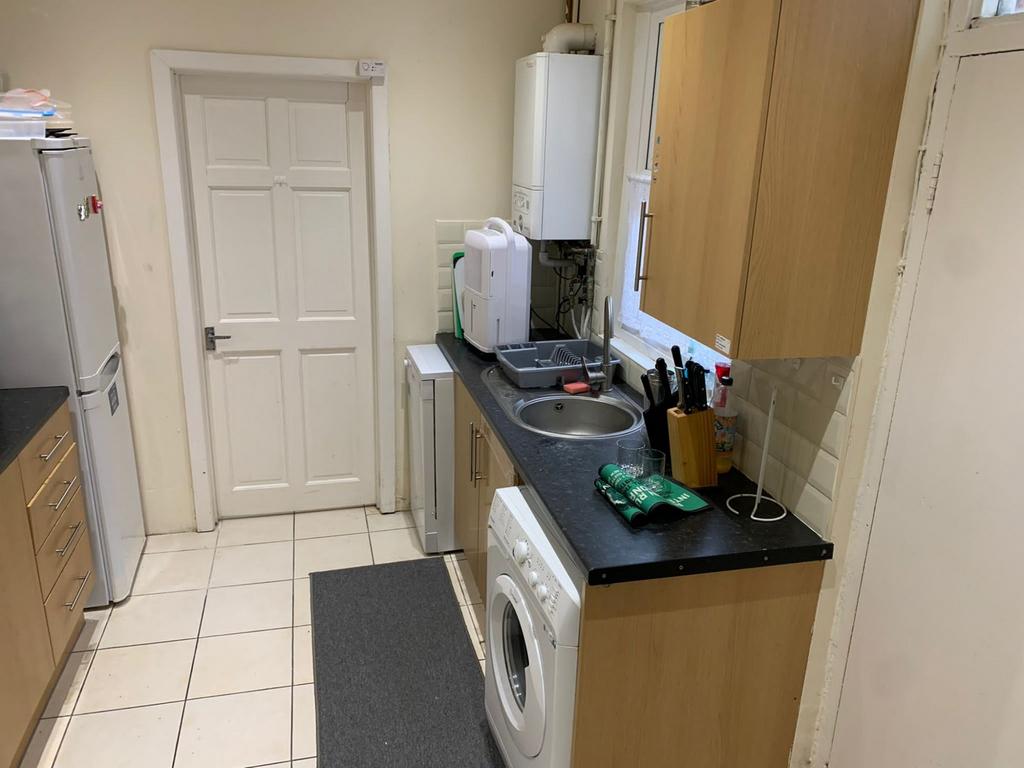 Spacious kitchen featuring modern appliances, a...