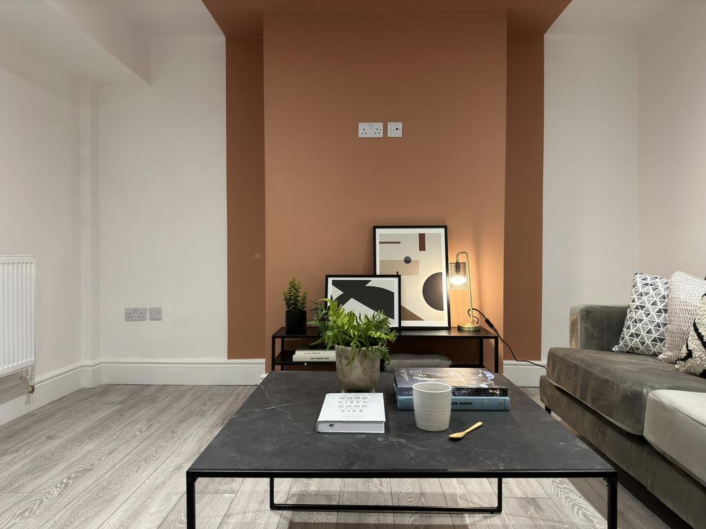 A stylish and inviting living room with modern ...