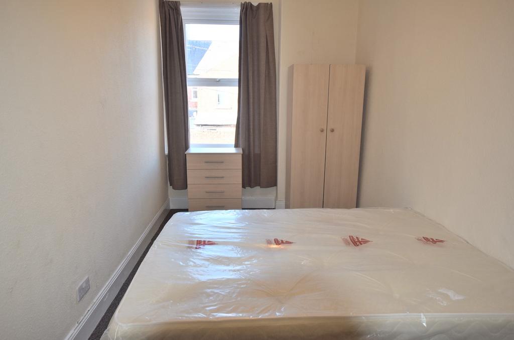 This inviting double bedroom features ample spa...