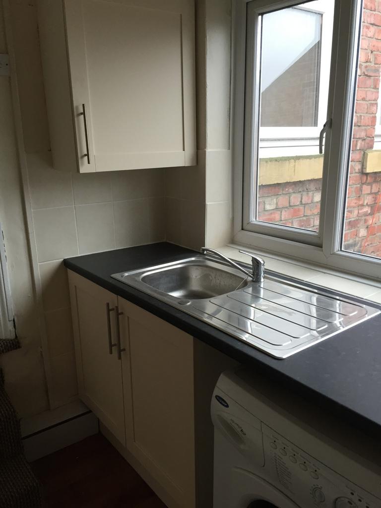 This kitchen features a practical layout with m...