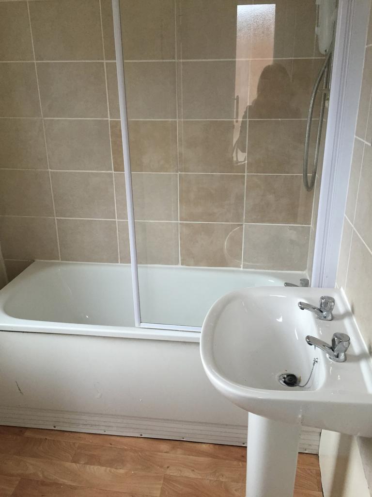 A modern bathroom featuring a clean and spaciou...