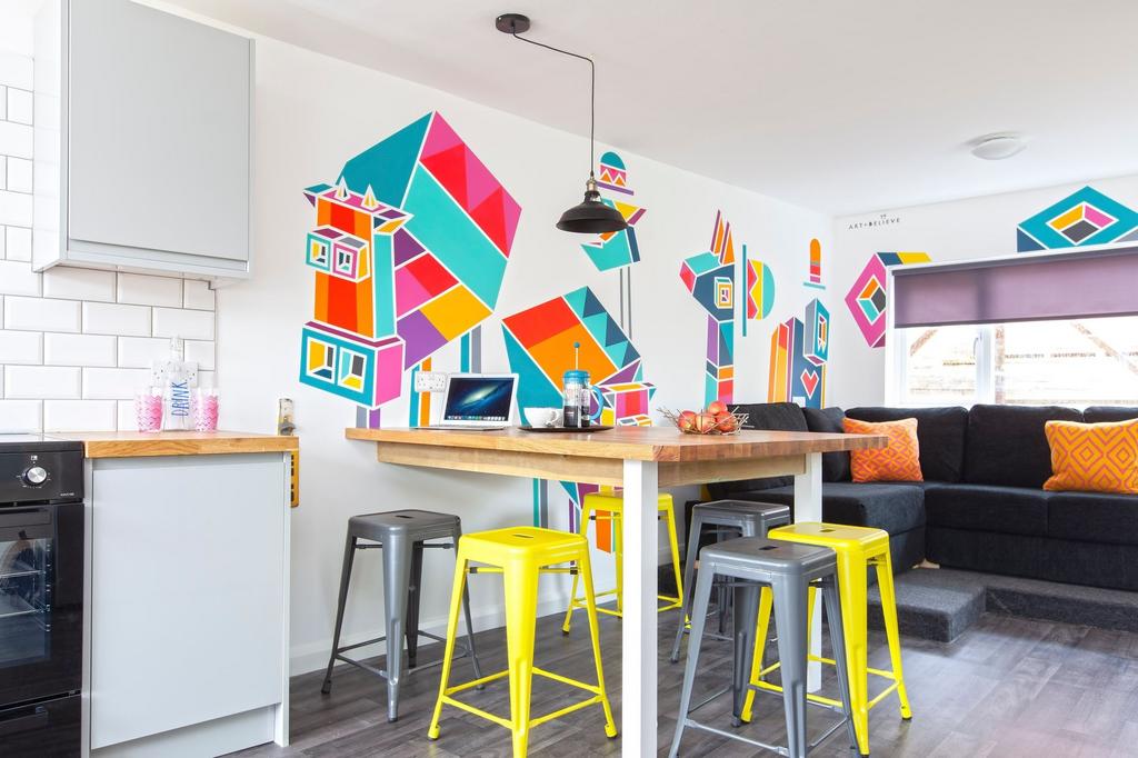 Bright and modern kitchen area featuring vibran...