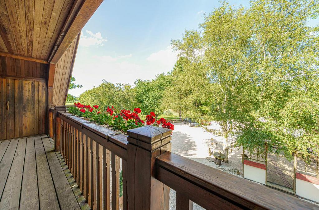 Large balcony with views over the front courtyard