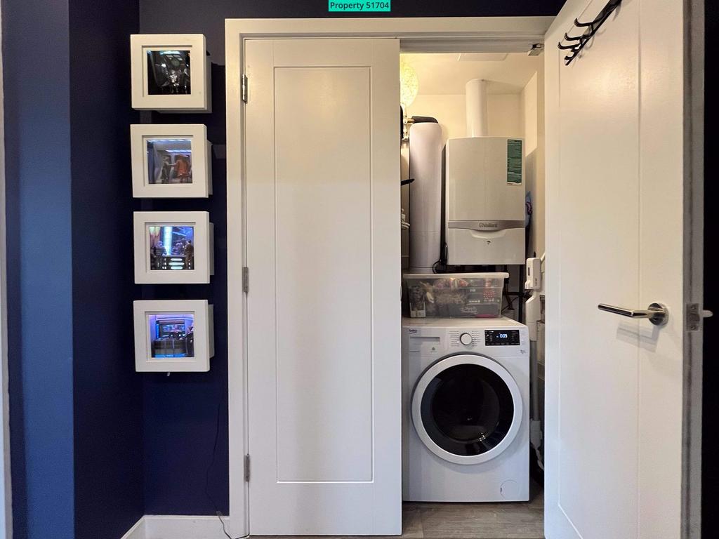 Large utility cupboard with washer dryer