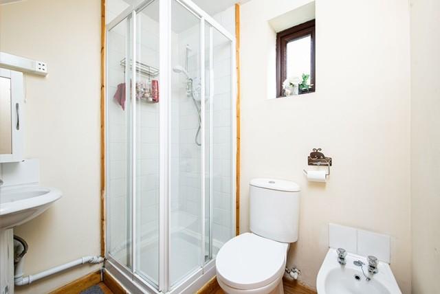 A well-maintained bathroom featuring a modern s...