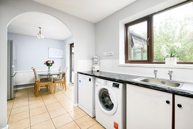 Bright and spacious kitchen area featuring mode...