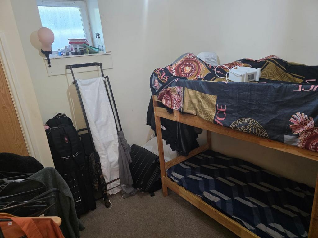 Cozy double bedroom featuring a bunk bed and am...