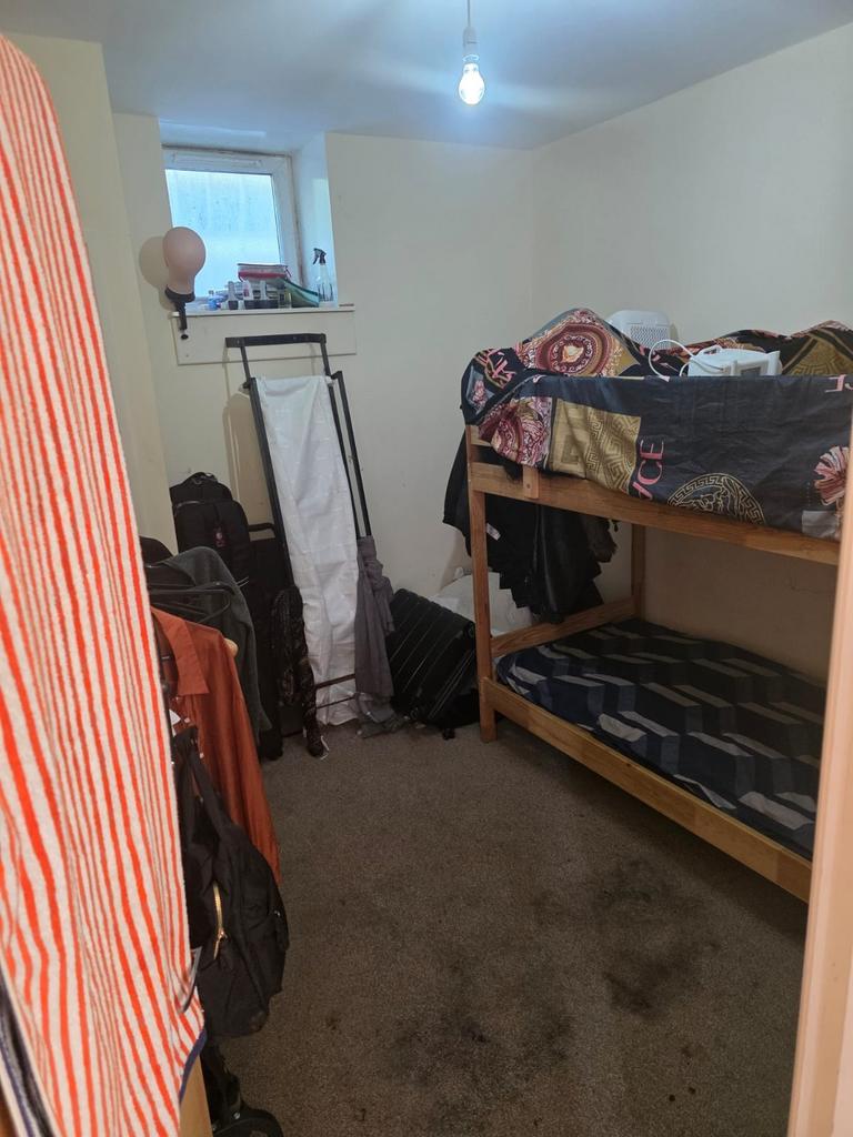 Cozy double bedroom featuring ample storage spa...