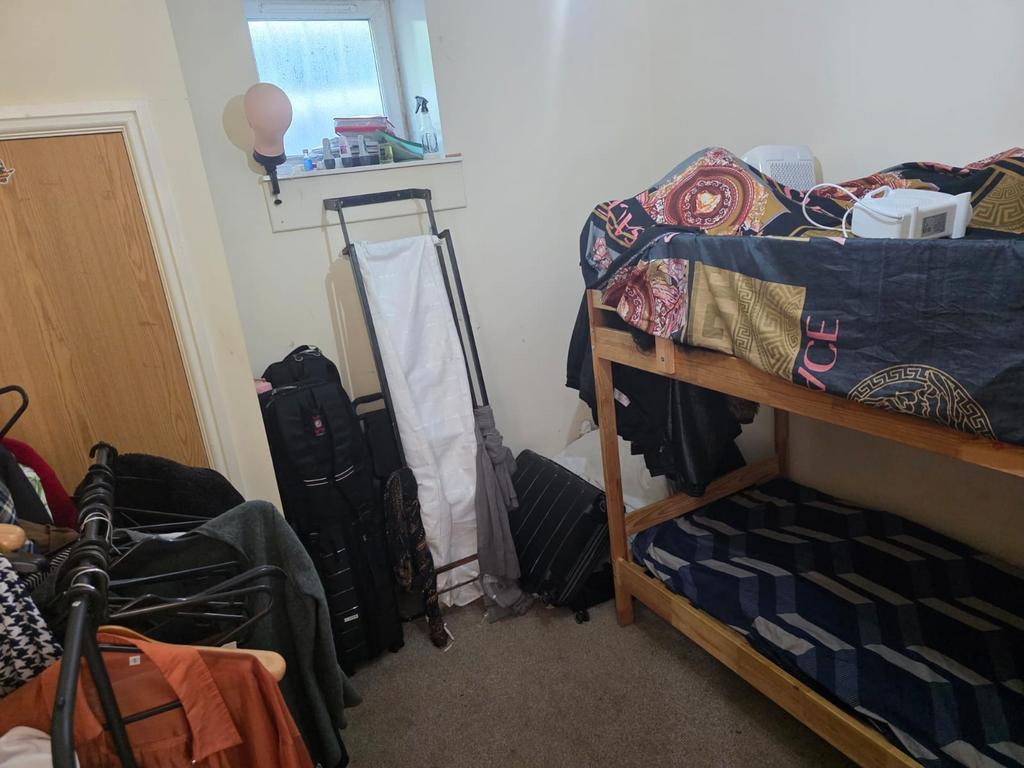 A cozy double bedroom featuring a comfortable b...
