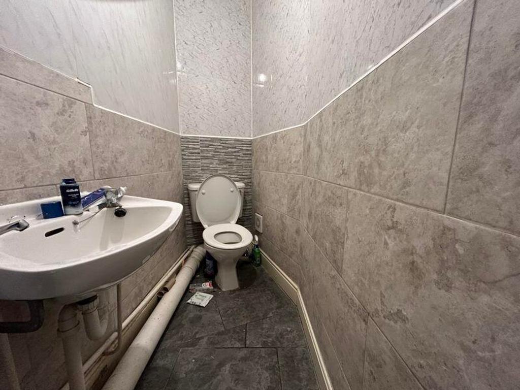 A compact single toilet featuring modern finish...