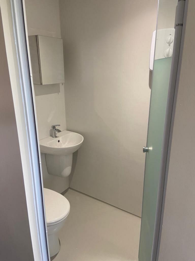 Bright and modern bathroom featuring a sleek de...