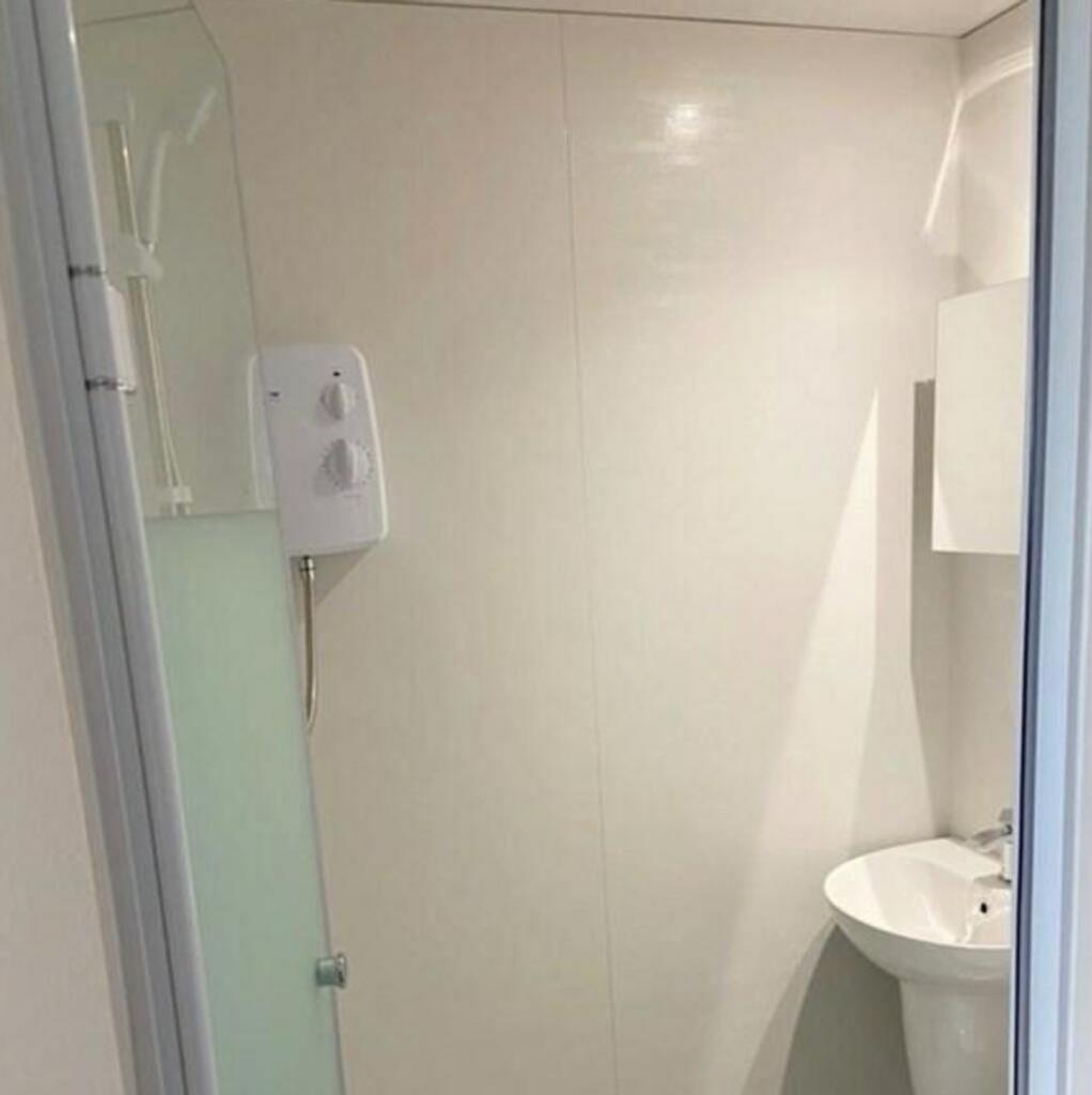 A modern bathroom featuring a clean design with...