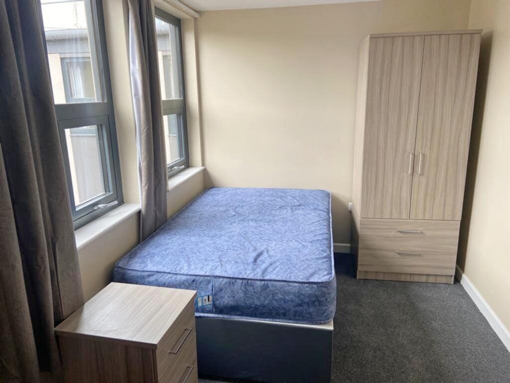 Bright and inviting double bedroom featuring la...
