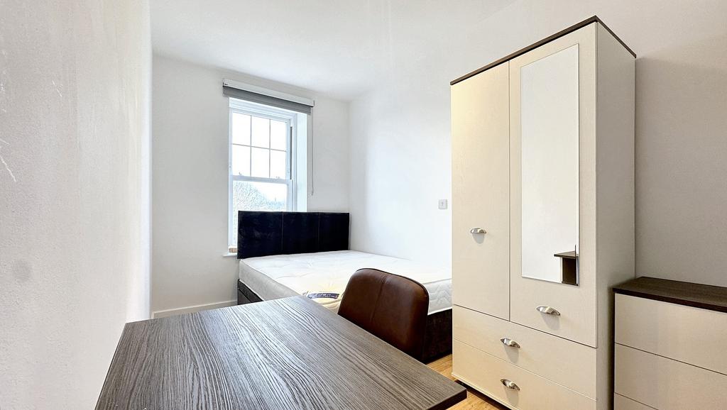 Bright and inviting double bedroom featuring a ...