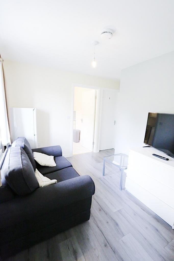 Bright, modern living area with a comfortable d...