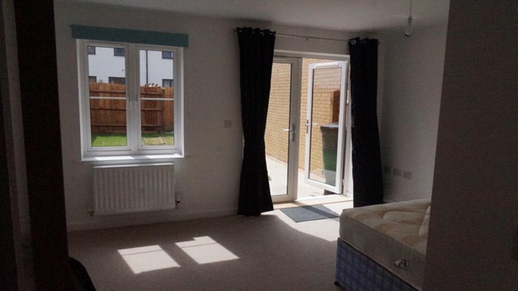 Bright and inviting double bedroom featuring la...