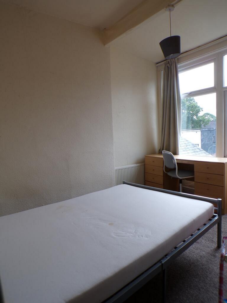 A bright and spacious double bedroom featuring ...