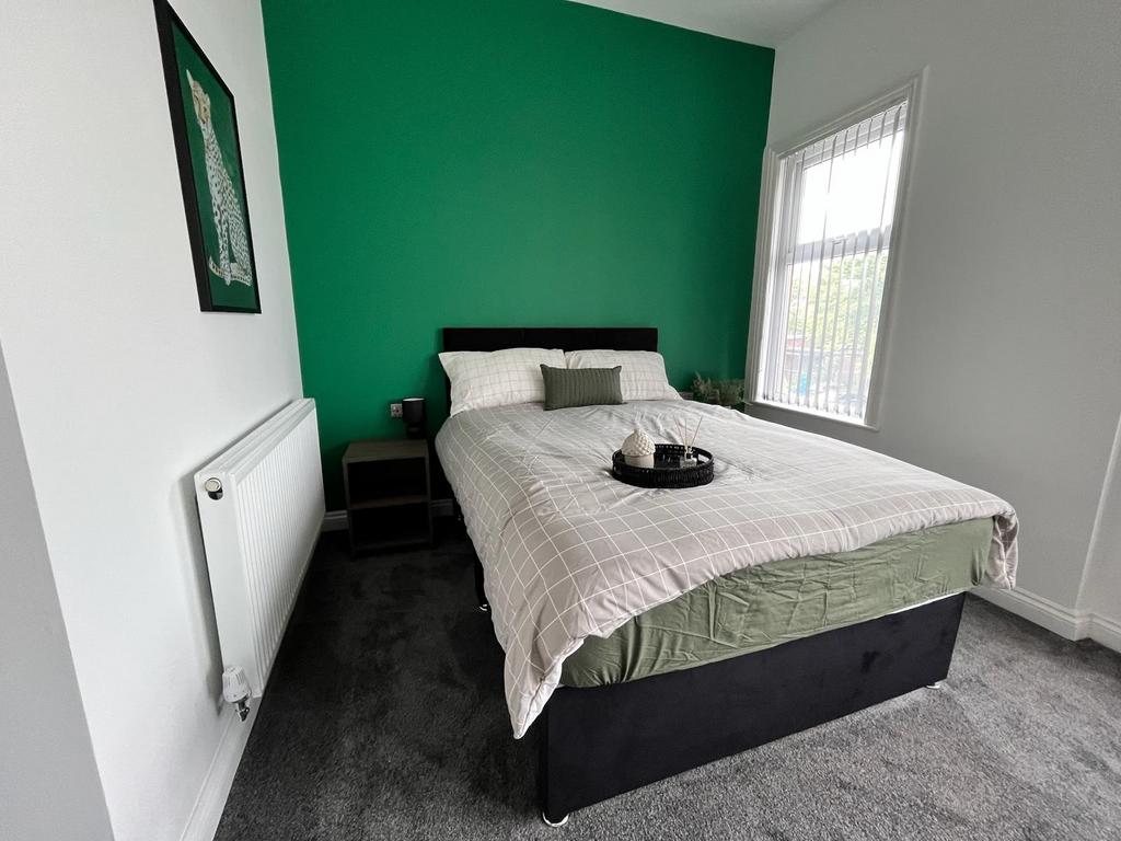 A beautifully presented double bedroom featurin...