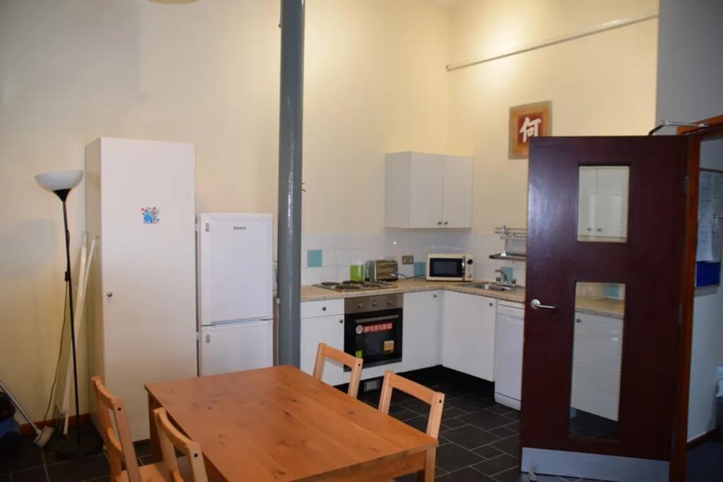 Spacious kitchen featuring modern appliances, a...