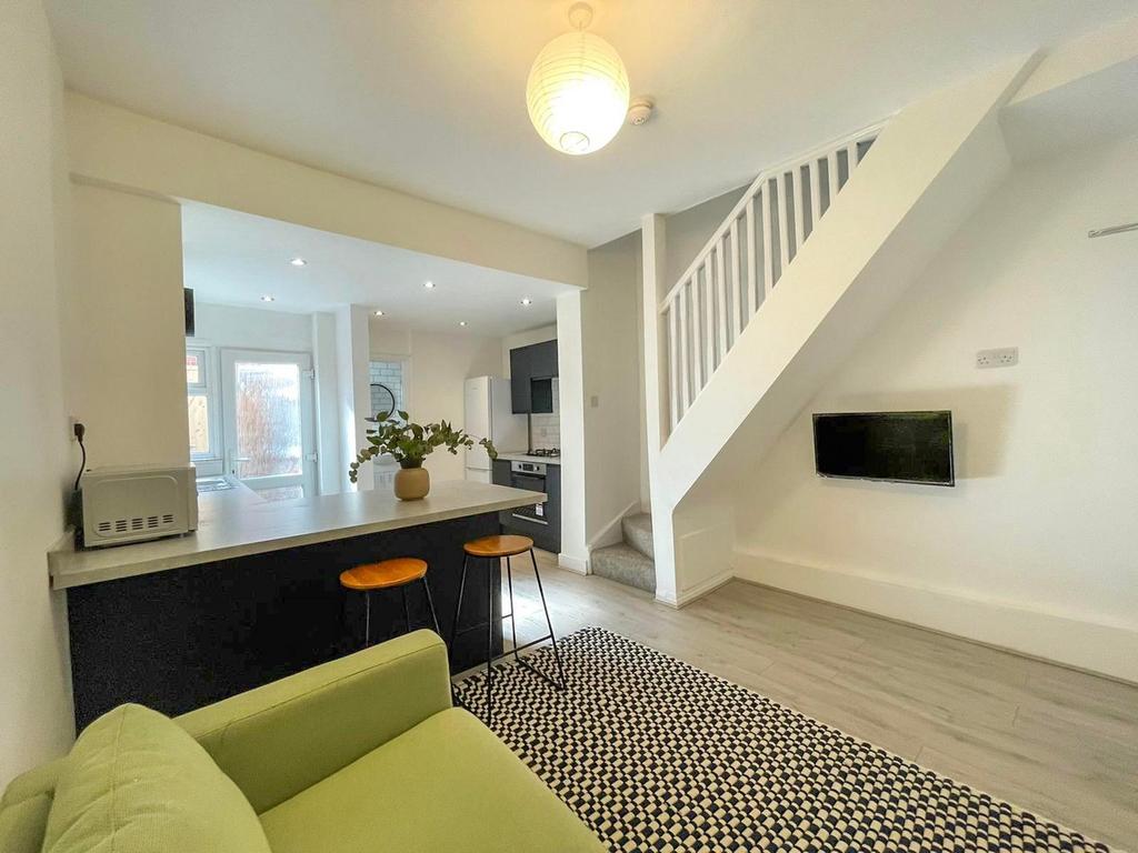 A bright and modern kitchen space with stylish ...