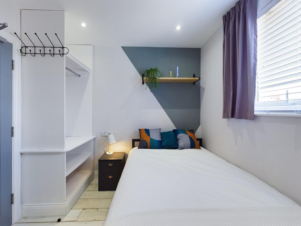A stylish and inviting double bedroom featuring...