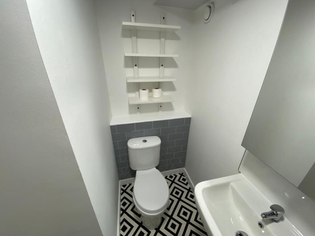 A stylish bathroom featuring modern fixtures an...