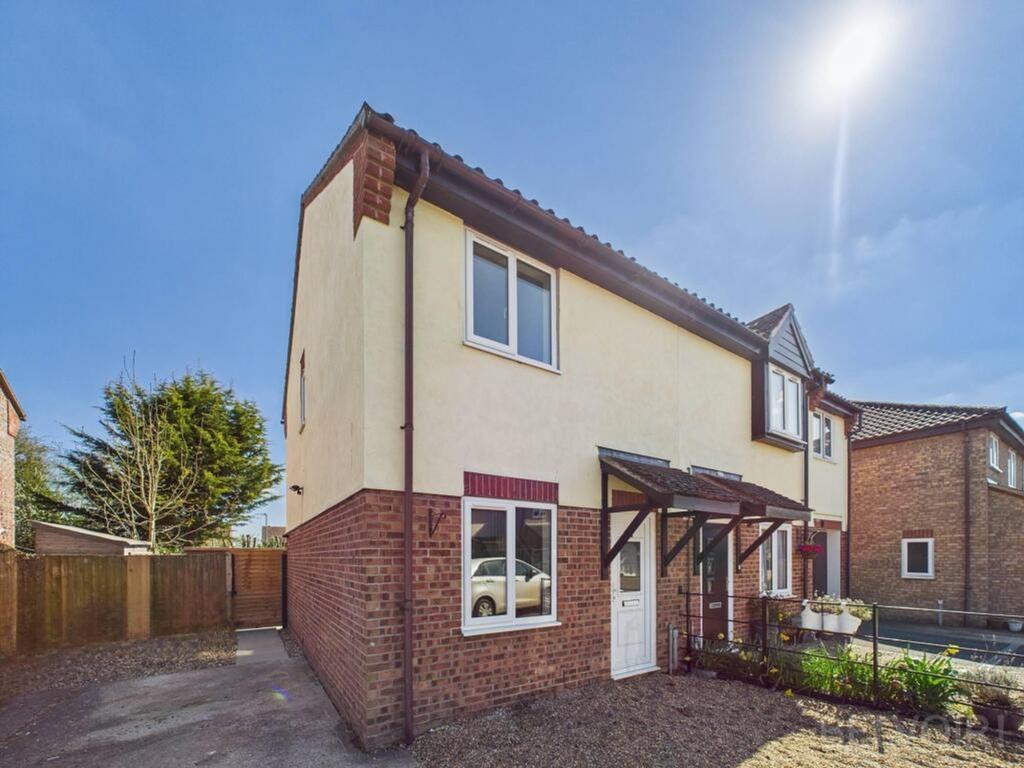Charming front view of a well-maintained semi-d...