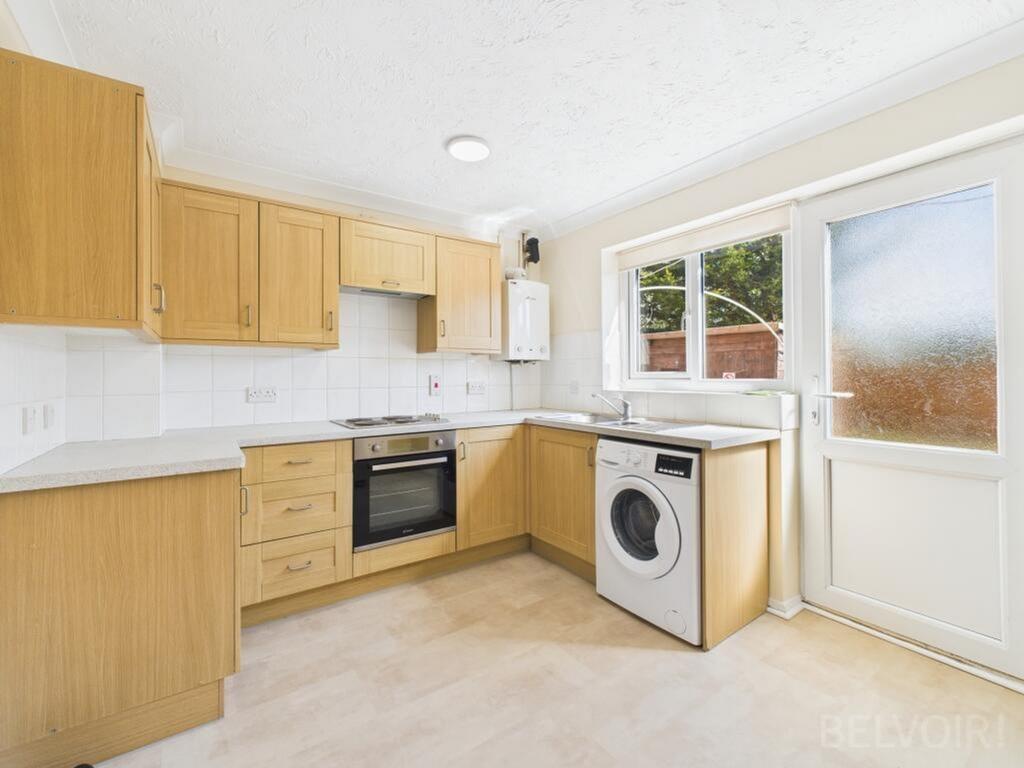 Bright and spacious kitchen featuring modern ca...