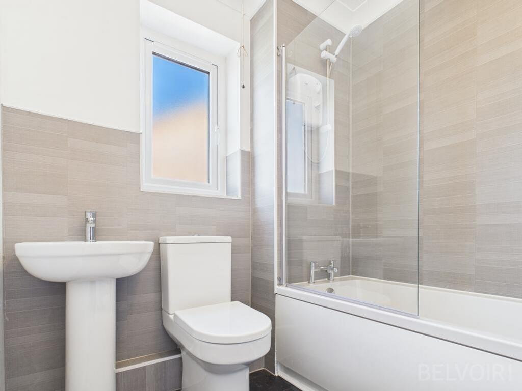 This modern bathroom features a sleek design wi...