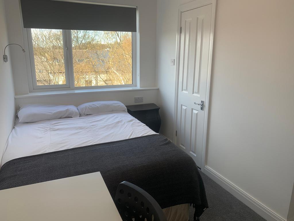 Bright and inviting double bedroom featuring a ...