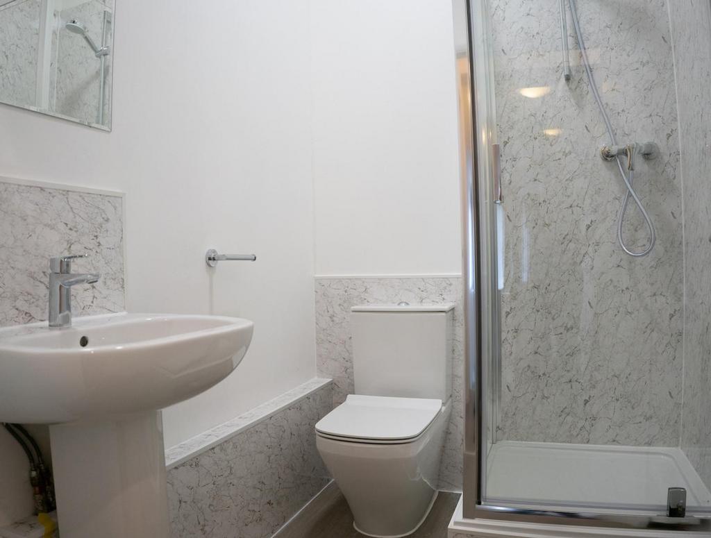 A modern and clean bathroom featuring a stylish...