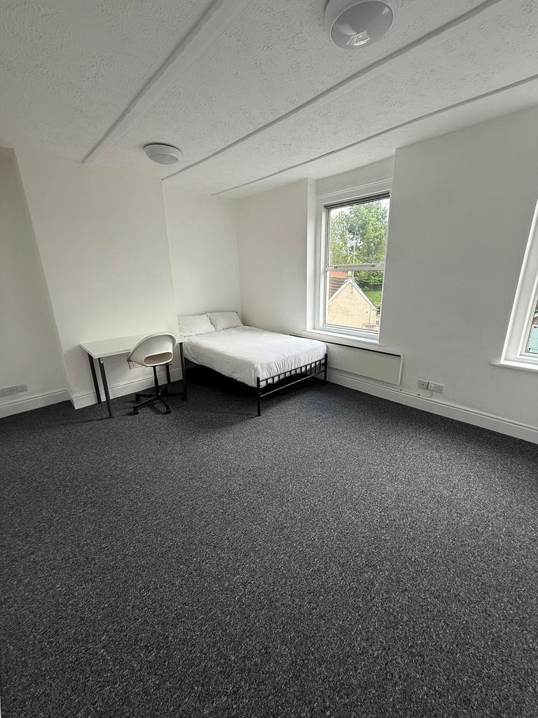 Bright and inviting double bedroom featuring am...