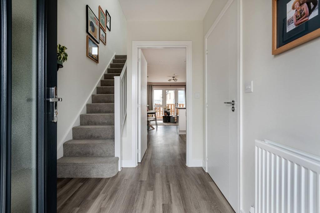 The entrance hallway is light and airy offering...
