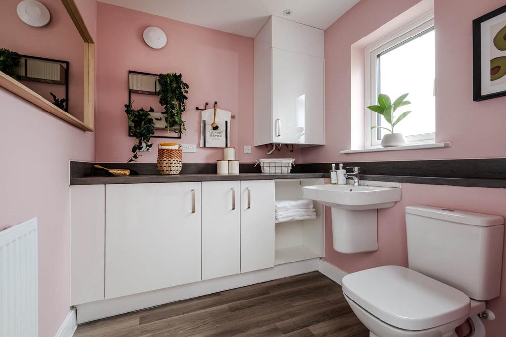 The handy utility room offers plenty of storage...