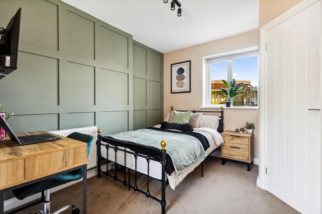 This inviting double bedroom features a comfort...