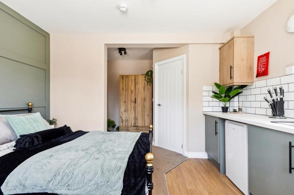 This inviting double bedroom features a cozy ae...