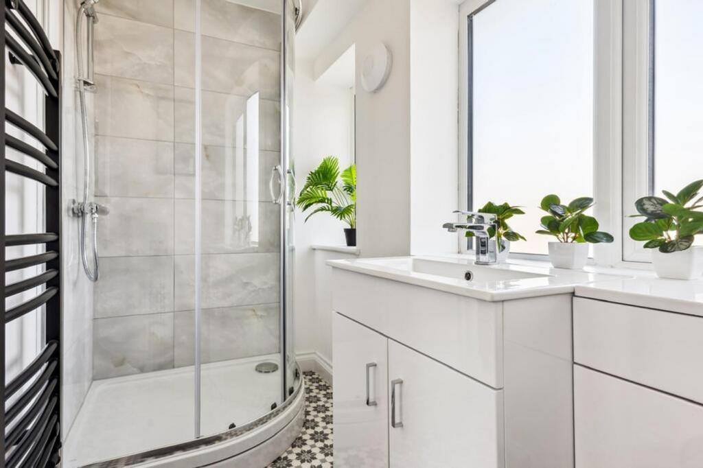 This stylish bathroom suite features a spacious...