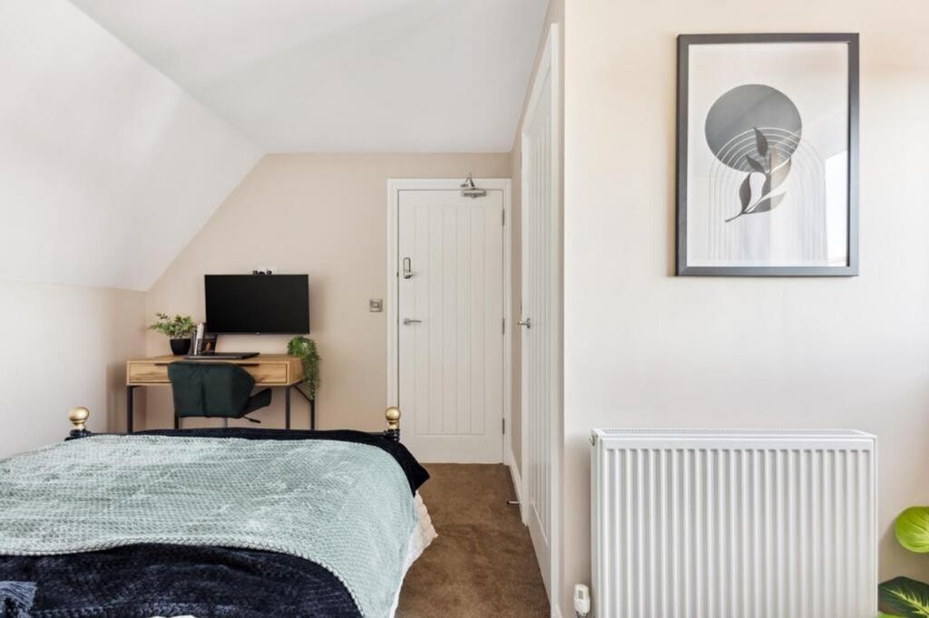 A stylish double bedroom featuring a cozy bed, ...