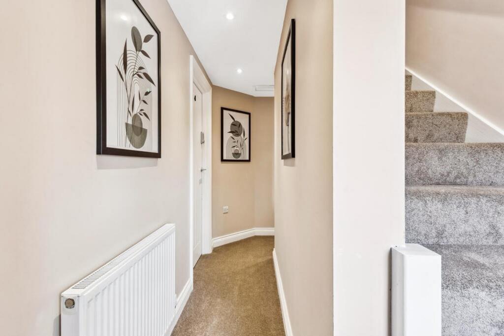 A stylish and well-maintained hallway featuring...