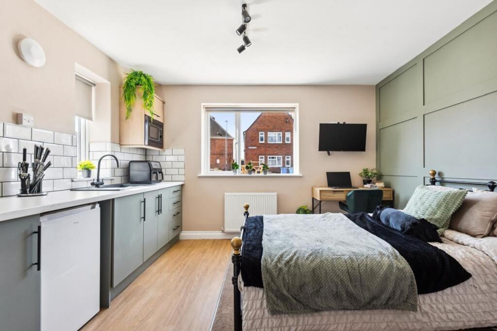 Stylish double bedroom featuring a cozy bed, mo...