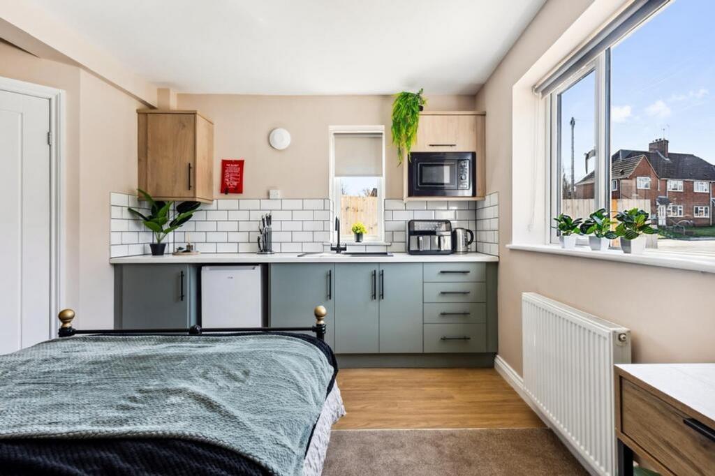 This inviting double bedroom features a cozy la...